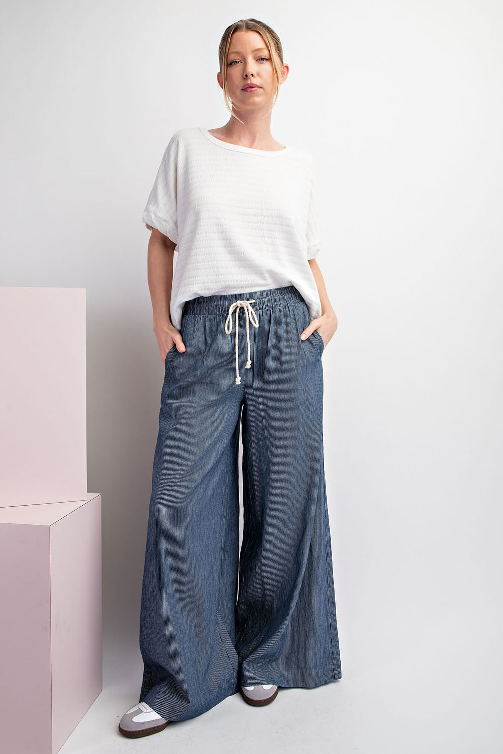 woman wearing wide-leg pants with a drawstring