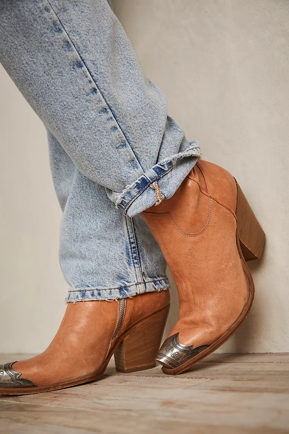 Jeans and tan cowboy boots