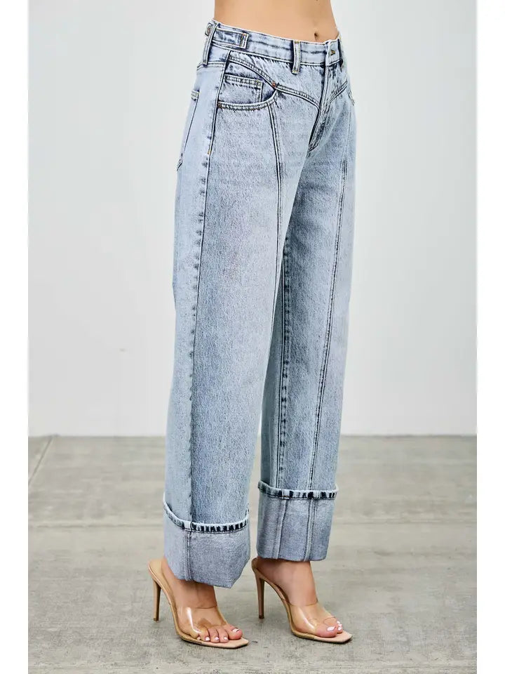 acid wash high rise barrel jeans with western cut.