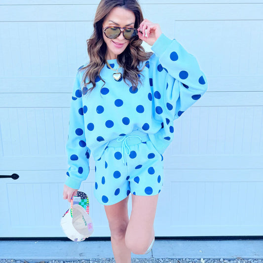 Blue polka dot shorts with a tie waist.