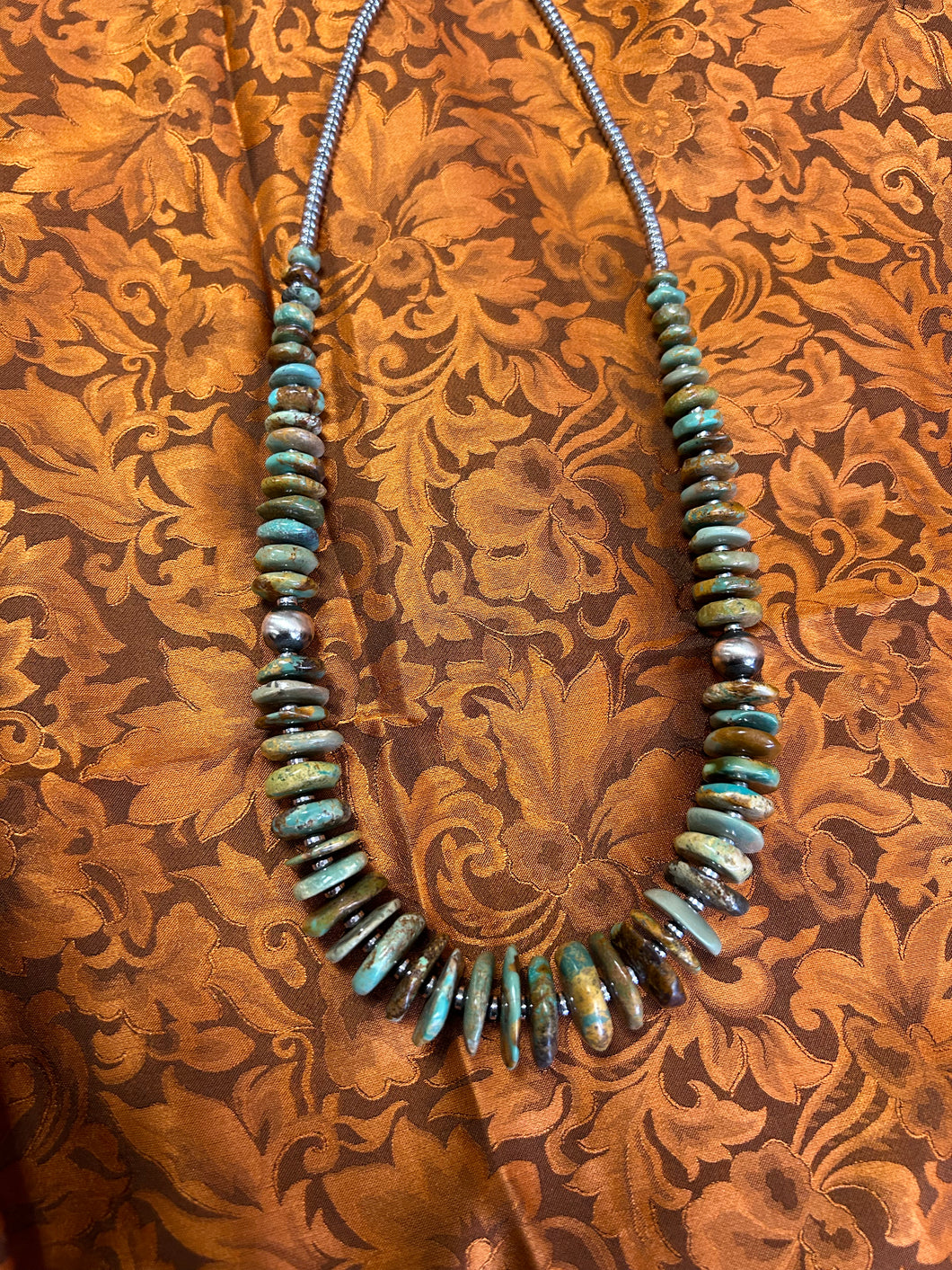 22 inch graduated turquoise necklace with Navajo pearl