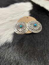 Load image into Gallery viewer, silver hand stamped concho earrings with turquoise centers.
